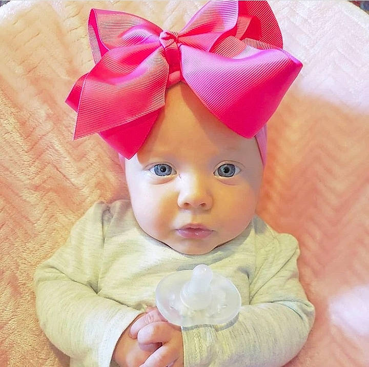 Chandler joined the competition — help win amazing prizes! baby, baby_products, baby_toddler_clothing, child, ear, fashion_accessory, hair_accessory, head, headband, headgear, headwear, person, pink, product, skin, smile, toddler