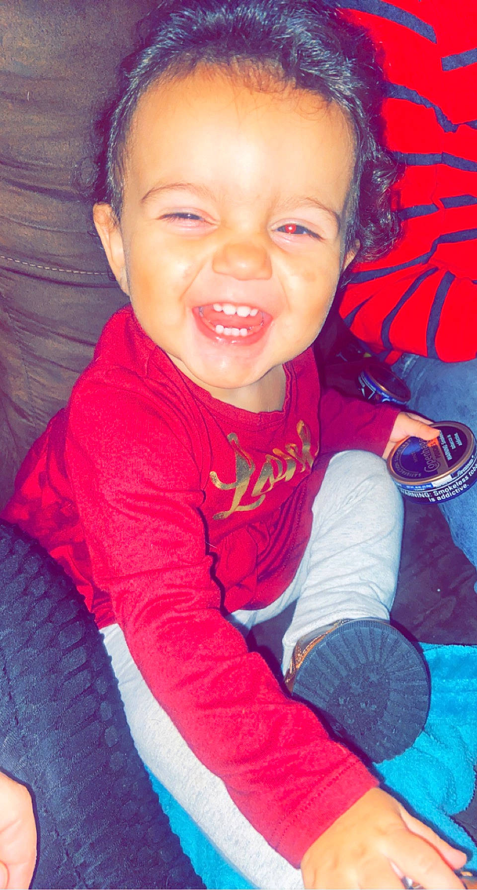 Adaia is registered to the contest to win money with this photo: arm, baby_toddler_clothing, cheek, eye, facial_expression, forehead, gesture, happy, head, human_body, iris, lip, mouth, nose, organ, person, product, purple, skin, sleeve