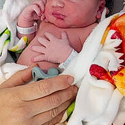 Shadrach joined the competition — help win amazing prizes! adult_hand, baby, baby_bracelet, bed, blanket, closeup, comfort, cute, hand, hospital, infant, newborn, pacifier, peaceful, person, resting, skin, sleeping, soft, wrapped