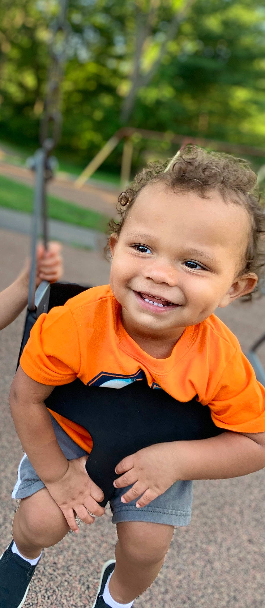 Lonnell Jr joined the competition — help win amazing prizes! child, child_model, city, facial_expression, fun, happy, human_settlement, joy, leisure, orange, outdoor_play_equipment, person, photography, play, playground, public_space, recreation, smile, swing, toddler