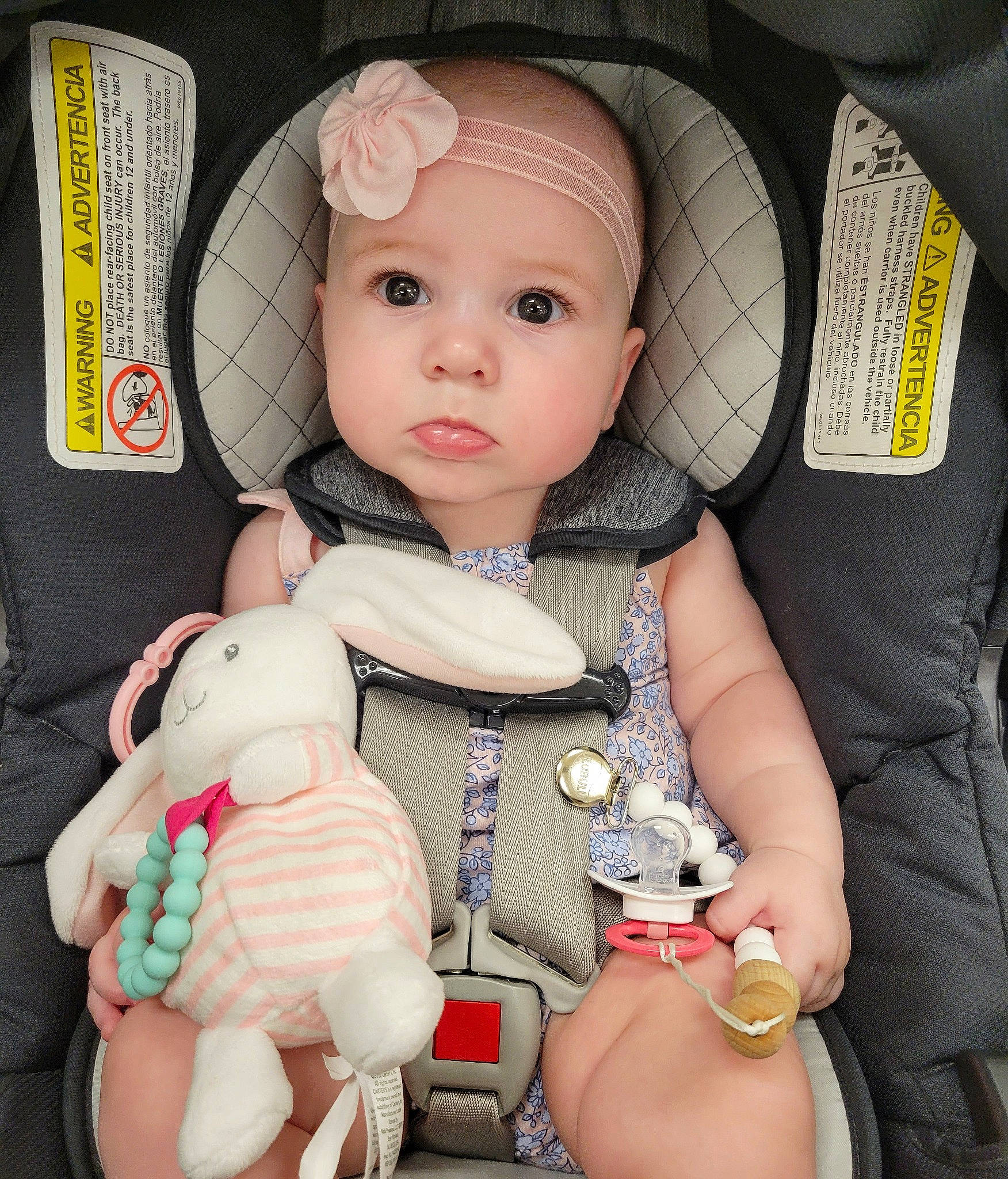 Charlotte is registered to the contest to win money with this photo: baby, baby_carriage, baby_products, baby_toddler_clothing, car_seat, cheek, child, doll, eye, eyelash, head, headwear, mouth, person, pink, product, skin, sleeve, stuffed_toy, thumb
