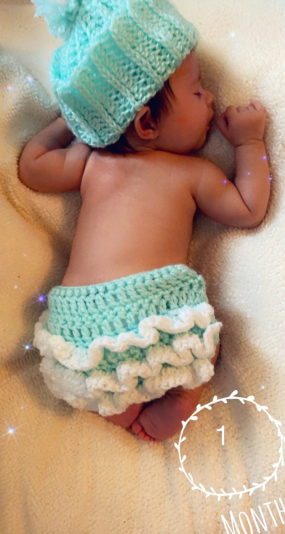 Adaliena Grace is registered to the contest to win money with this photo: abdomen, aqua, arm, art, baby, baby_products, baby_sleeping, baby_toddler_clothing, blue, cap, diaper, finger, green, jewellery, linens, nail, pattern, person, pink, textile