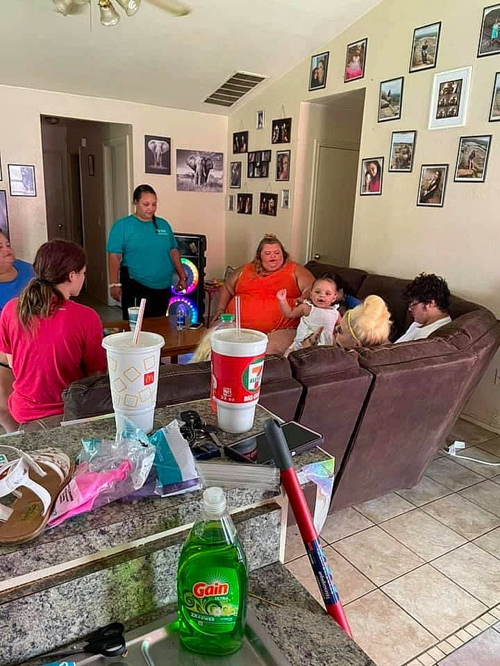 Journee joined the competition — help win amazing prizes! art, bottle, couch, drink, event, floor, flooring, house, leisure, living_room, person, photograph, picture_frame, plastic_bottle, room, snapshot, soft_drink, t_shirt, table, visual_arts