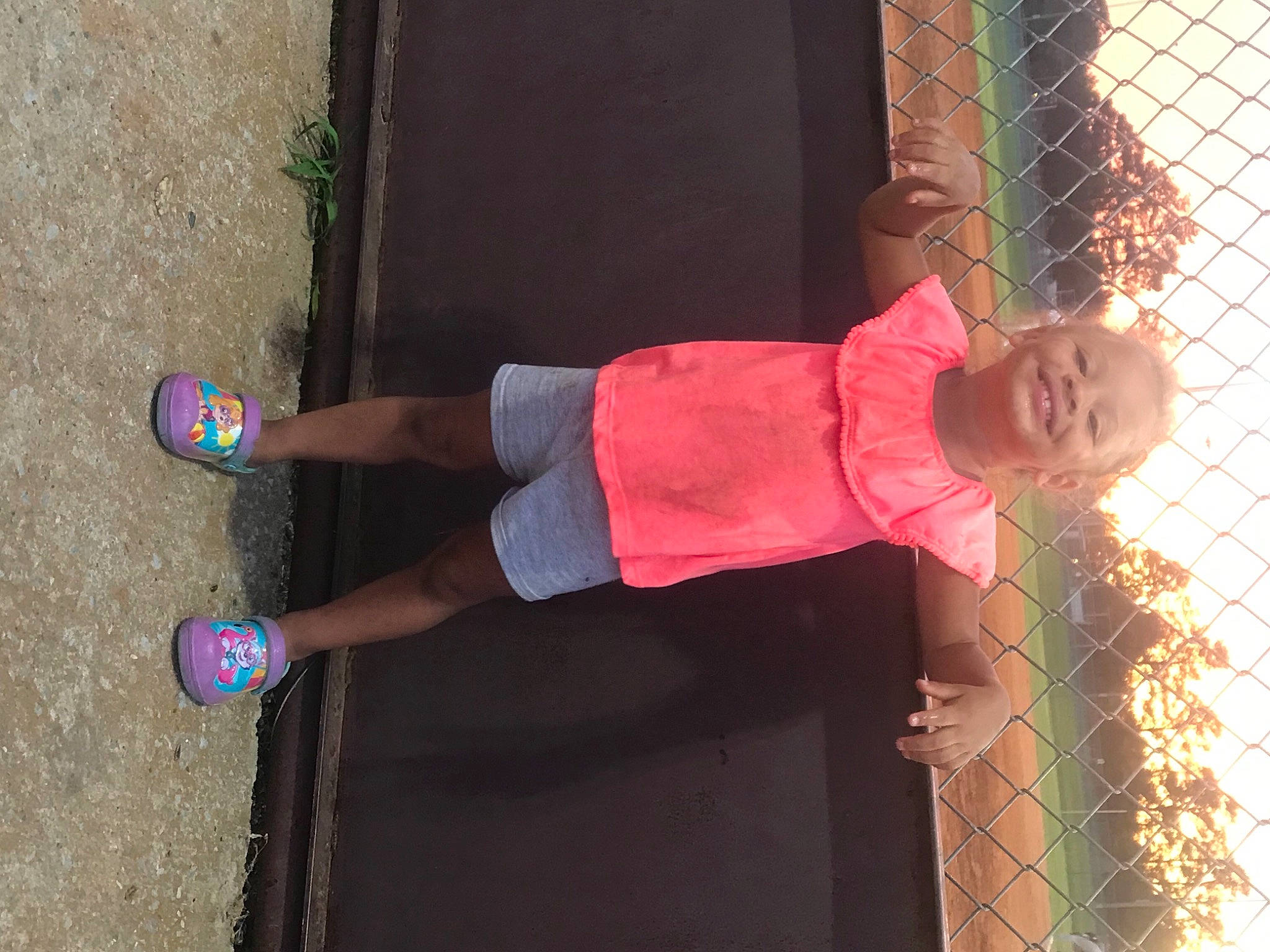 Saniyah is registered to the contest to win money with this photo: arm, calf, clothing, door, foot, hat, human_leg, joint, joy, knee, leg, magenta, mesh, person, pink, sandal, shorts, smile, street_fashion, textile