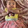 Eilani is registered to the contest to win money with this photo: baby, child, infant, yellow_clothing, pink_skirt, butterfly_pattern, headband, blanket, clapping, cute, lying_down, indoors, soft_texture, pink, yellow, person, toddler, smiling, hands, apparel