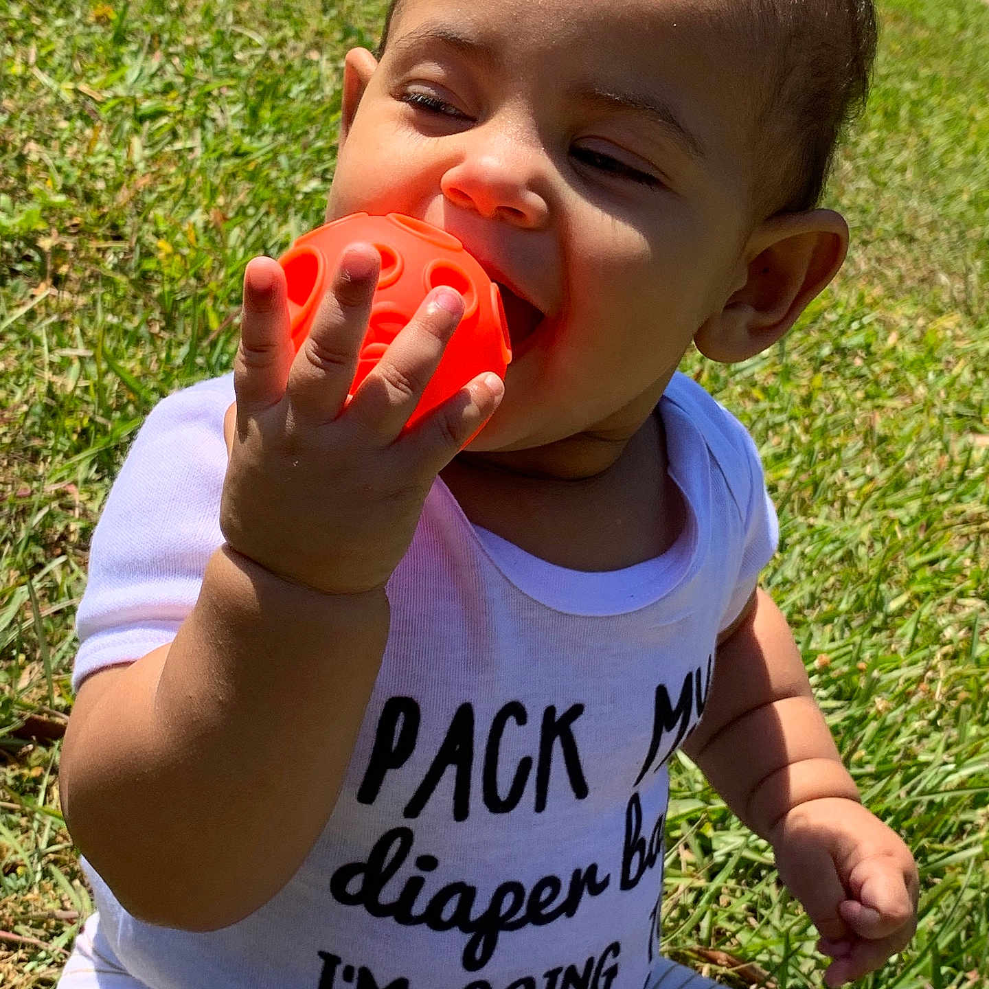 Cemora is registered to the contest to win money with this photo: baby, bodypart, bottle, clothing, cream, eating, face, finger, food, grass, hand, head, lawn, person, photography, plant, portrait, shaker, summer, t_shirt