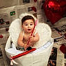 baby, child, wings, cupid, heart, arrow, basket, newspaper, balloon, red, white, costume, halo, cute, portrait, indoor, celebration, valentines_day, smiling, person