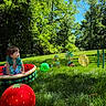 Kreg joined the competition — help win amazing prizes! toddler, child, inflatable_pool, grass, balloons, fruit_balloons, watermelon, strawberry, tropical, aloha, sign, summer, outdoor, sunny, trees, greenery, playful, happy, blue_sky, nature