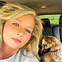 Penny is registered to the contest to win money with this photo: animal, backseat, blonde_hair, blue_eyes, calm, car_interior, casual_clothing, companion, dog, earrings, indoor, leisure, natural_light, pet, portrait, relaxed, seat, seatbelt, selfie, woman