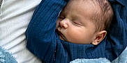 Zion joined the competition — help win amazing prizes! baby, bed, blanket, blue, child, clothing, comfort, cozy, cute, face, indoors, infant, newborn, peaceful, portrait, rest, sleeping, soft, toddler, warm