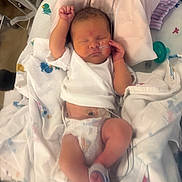 Zion is registered to the contest to win money with this photo: baby, baby_bed, blanket, child, clothing, cute, diaper, healthcare, hospital, incubator, infant, lying_down, medical_tube, newborn, peaceful, person, pillow, resting, sleeping, small