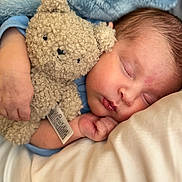 Zion is registered to the contest to win money with this photo: baby, sleeping, teddy_bear, cuddle, blanket, soft, cute, infant, peaceful, closeup, face, hand, cozy, rest, child, plush, comfort, nap, warm, adorable