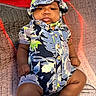 Kyaun joined the competition — help win amazing prizes! baby, infant, toddler, child, hat, clothing, patterned_outfit, sitting, quilt, bedspread, indoor, portrait, cute, chubby_cheeks, skin, person, fashion, colorful, casual, relaxed