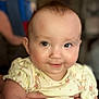 River joined the competition — help win amazing prizes! baby, child, smile, face, hand, holding, yellow_clothing, cute, infant, portrait, skin, eyes, cheeks, person, closeup, indoors, soft_light, expression, happy, young