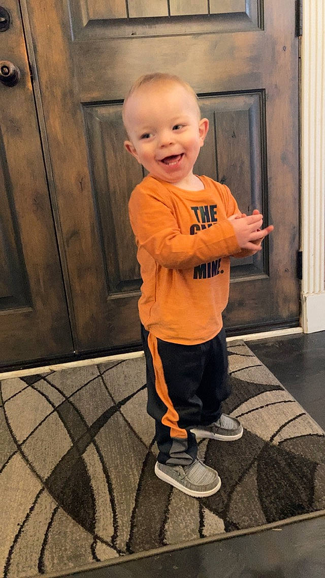 William is registered to the contest to win money with this photo: art, baby_toddler_clothing, child, door, floor, flooring, fun, happy, joy, orange, people, person, play, shoe, sleeve, smile, sneakers, standing, t_shirt, toddler