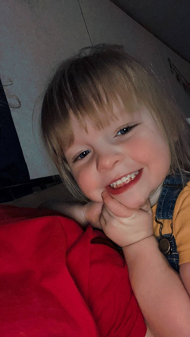 Amelia is registered to the contest to win money with this photo: arm, cheek, clothing, ear, eye, eyebrow, eyelash, flash_photography, forehead, gesture, hand, happy, iris, joy, lip, mouth, nose, person, skin, smile