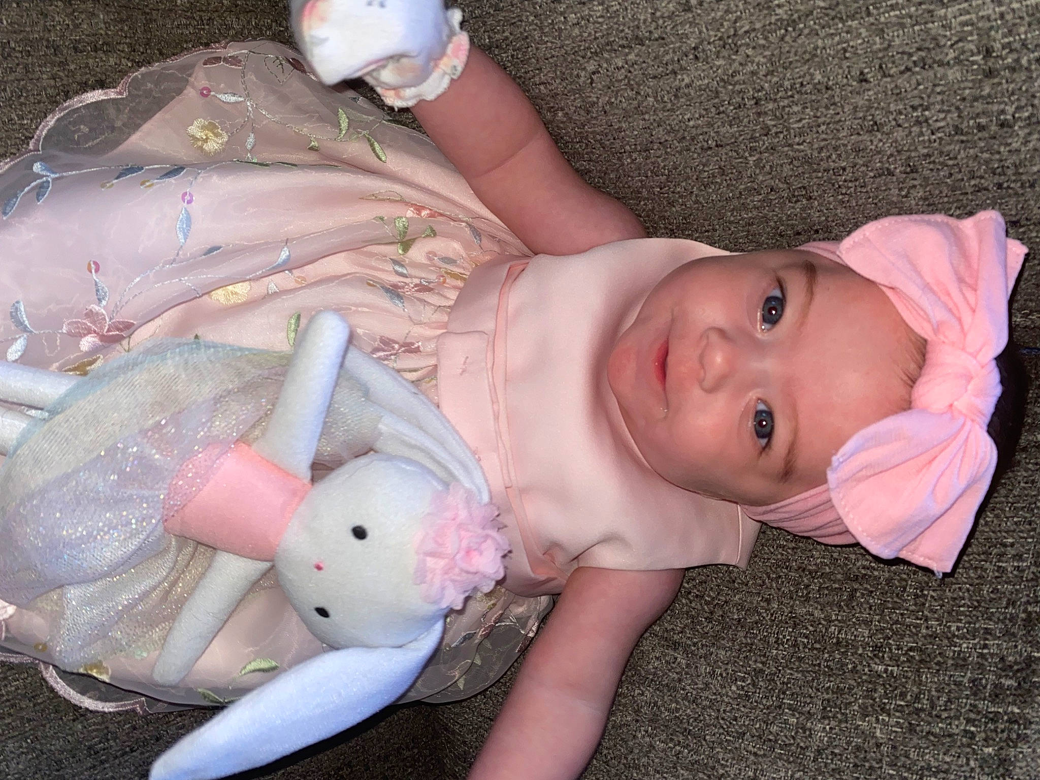 Iyla is registered to the contest to win money with this photo: baby, baby_products, baby_toddler_clothing, cheek, child, eye, finger, fun, hand, hat, headwear, human_body, lip, mouth, nail, nose, person, pink, skin, textile