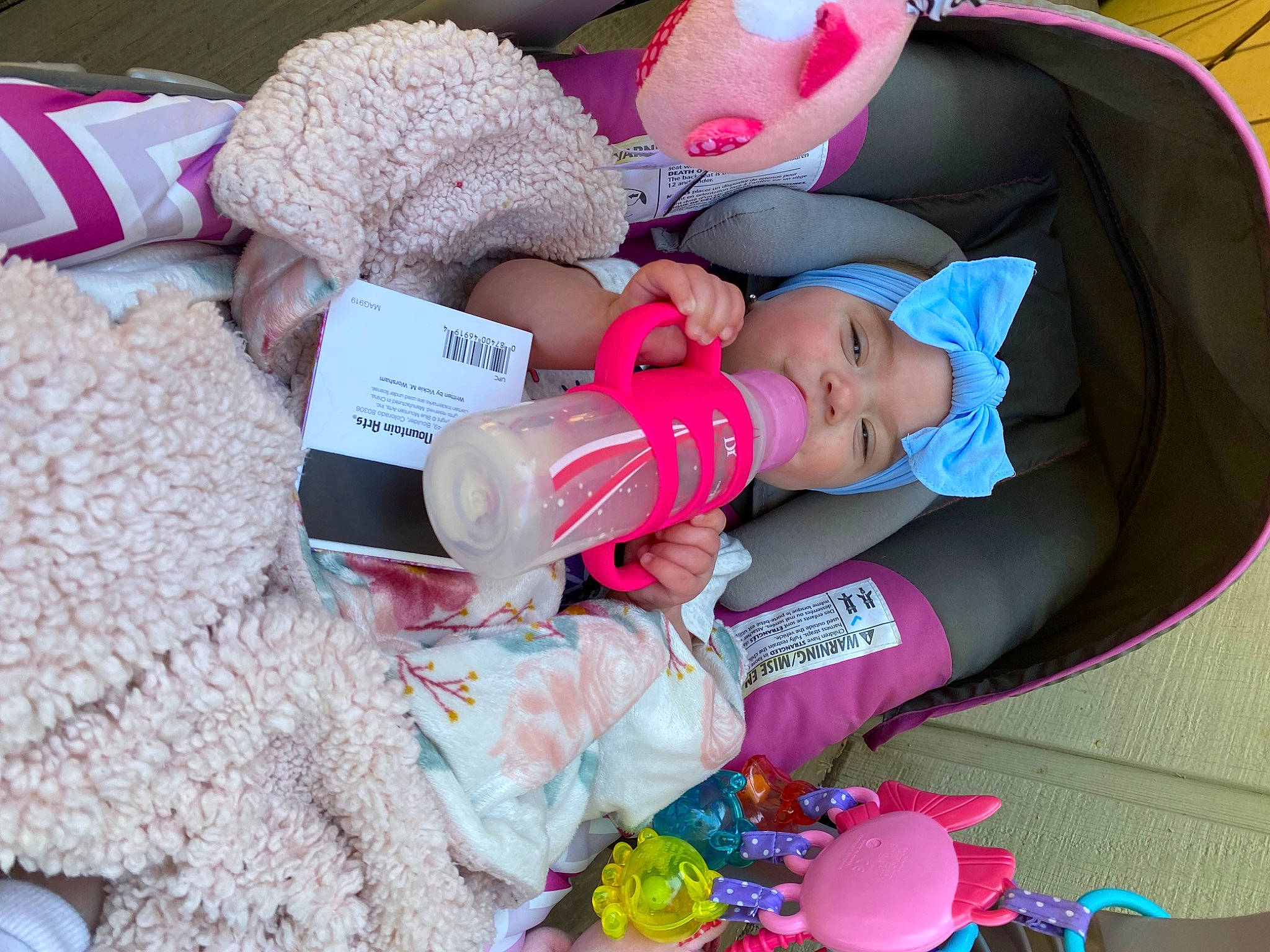 Iyla joined the competition — help win amazing prizes! baby, baby_products, baby_toddler_clothing, child, comfort, event, hat, headwear, lap, linens, magenta, pattern, person, pink, plastic, room, sitting, stuffed_toy, thread, toddler