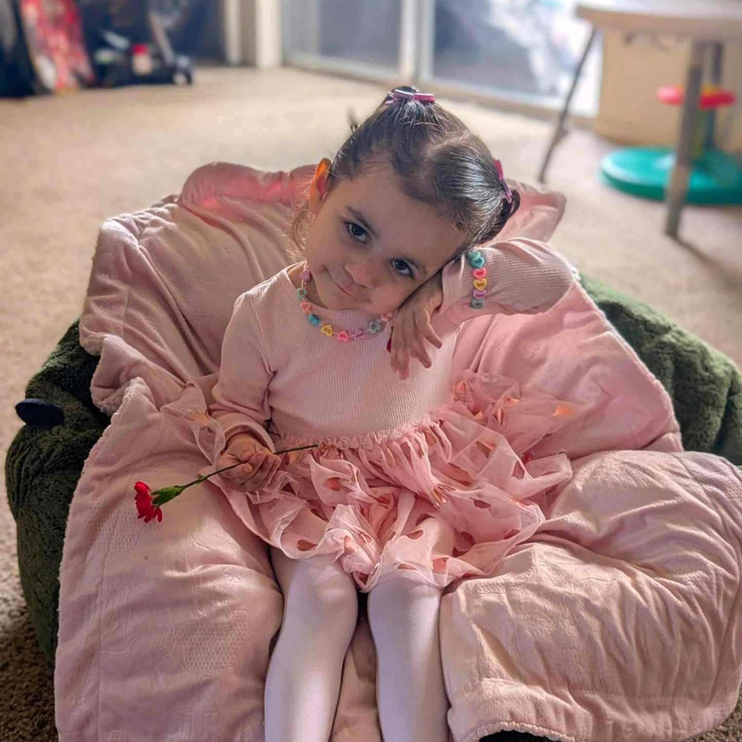 Leai is registered to the contest to win money with this photo: beanbag, blanket, child, female, furniture, girl, person, sitting