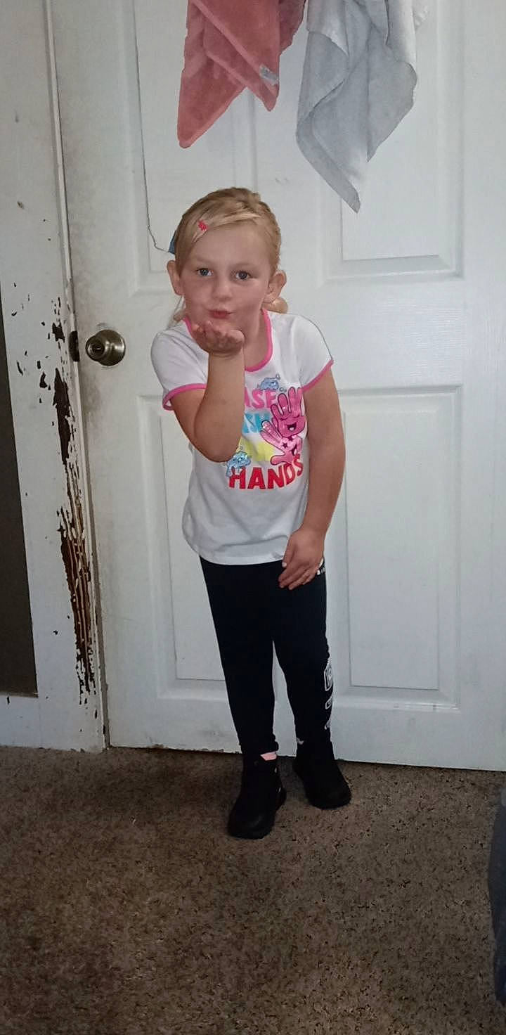 Aviah is registered to the contest to win money with this photo: baby_toddler_clothing, blond, door, elbow, electric_blue, footwear, head, human_leg, knee, leg, magenta, person, pink, sleeve, sportswear, standing, t_shirt, thigh, toddler, trunk