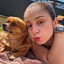 Perle participe au concours pour gagner de l'argent avec cette photo : woman, dog, outdoor, sky, clouds, fence, towel, brown_dog, puckered_lips, smartwatch, earrings, sunlight, grass, face, pet, lying_down, closeup, summer, relaxed, cute