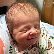 Colton joined the competition — help win amazing prizes! newborn, baby, smiling, sleeping, infant, blanket, clothing, face, head, cute, peaceful, resting, closeup, skin, child, portrait, indoors, soft, warm, comfort