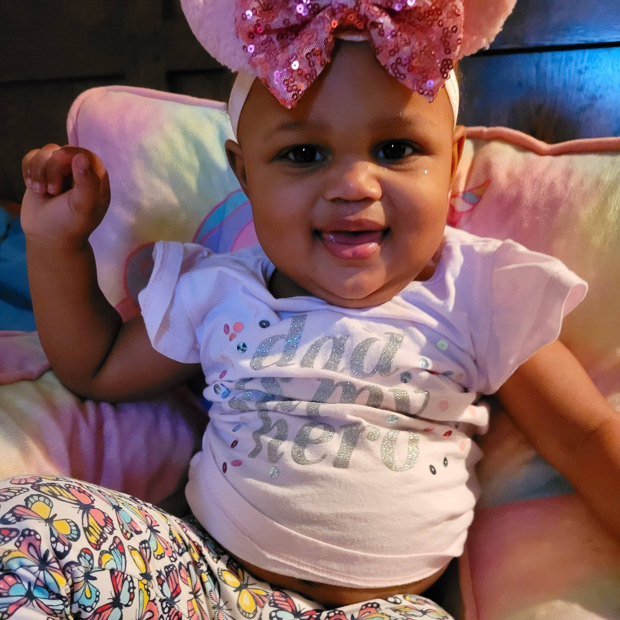 Keyonna is registered to the contest to win money with this photo: baby, baby_toddler_clothing, cap, cheek, child, comfort, costume_hat, facial_expression, finger, fun, happy, headgear, headwear, joy, person, pink, product, purple, skin, sleeve