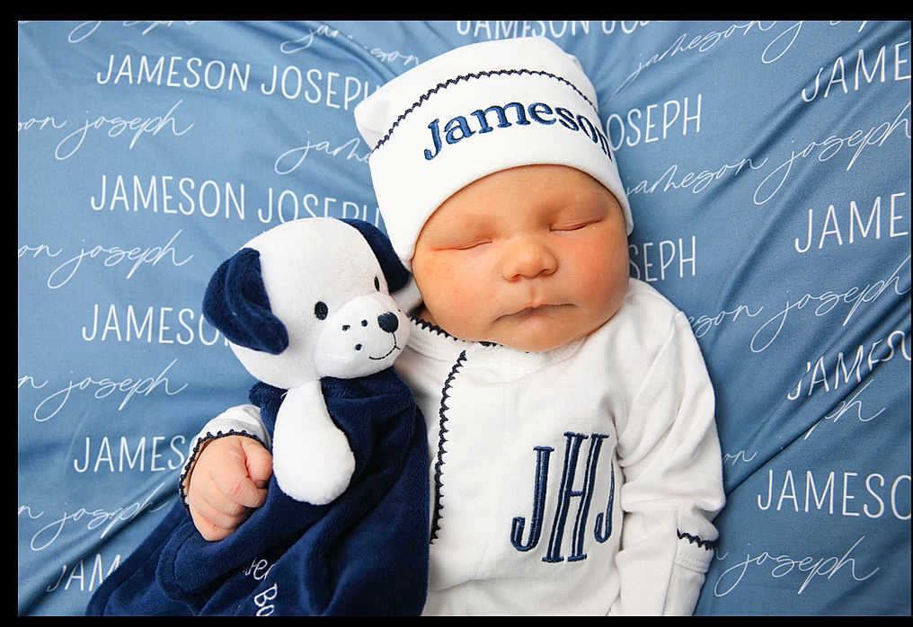 Jameson is registered to the contest to win money with this photo: newborn, baby, sleeping, infant, stuffed_animal, plush_toy, blue_blanket, white_outfit, hat, personalized_blanket, cuddling, cute, child, soft_toy, monogram, cozy, portrait, indoors, resting, peaceful