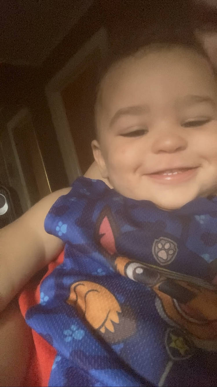 Kristofer is registered to the contest to win money with this photo: baby, baby_toddler_clothing, cheek, child, electric_blue, eye, eyebrow, finger, forehead, happy, iris, joy, lip, mouth, nose, person, sitting, skin, sleeve, smile