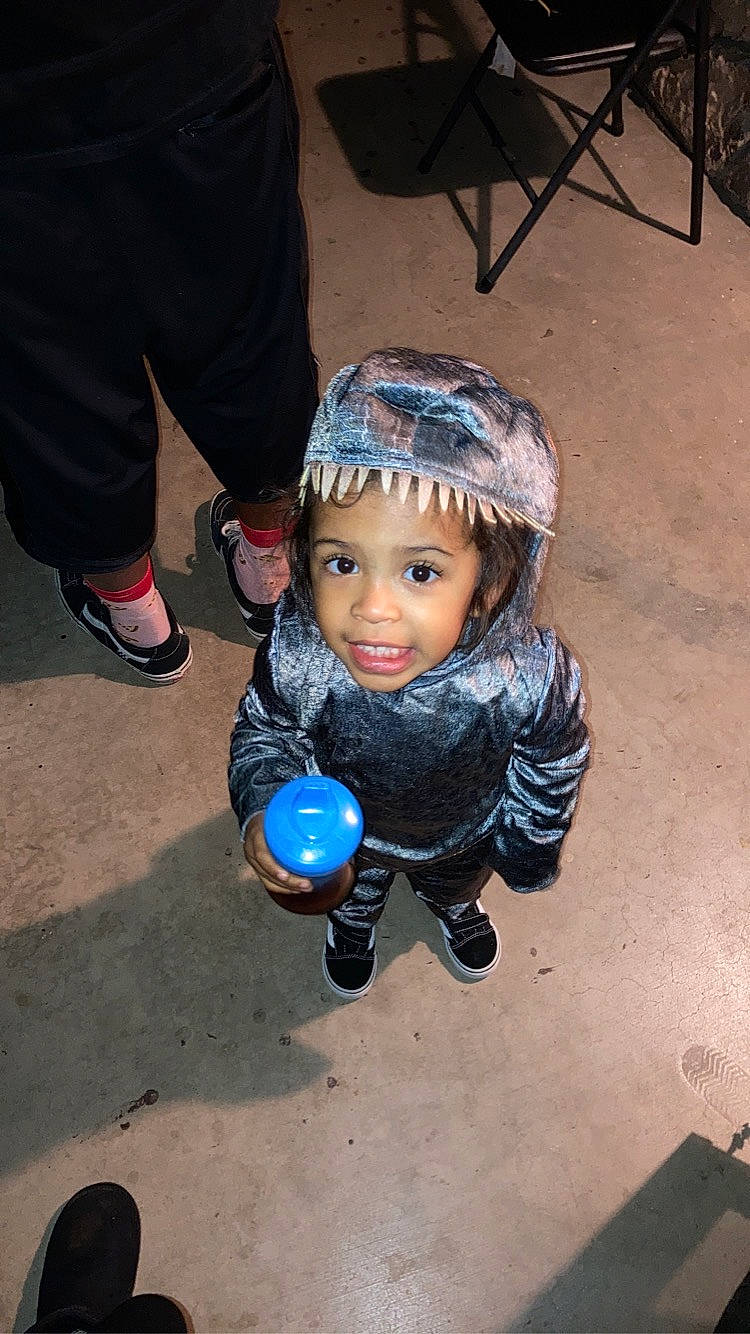 Darren joined the competition — help win amazing prizes! ball, child, concrete, electric_blue, flooring, fun, happy, human_leg, leg, person, personal_protective_equipment, play, road_surface, shadow, sitting, sneakers, soil, toddler, toy, winter