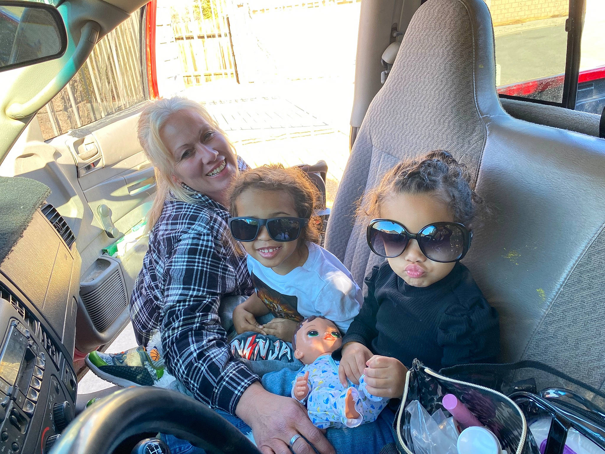 Janessa is registered to the contest to win money with this photo: automotive_design, automotive_exterior, automotive_tire, cool, eyewear, facial_expression, fun, glasses, goggles, joy, leisure, mode_of_transport, motor_vehicle, person, photograph, product, public_space, smile, summer, sunglasses