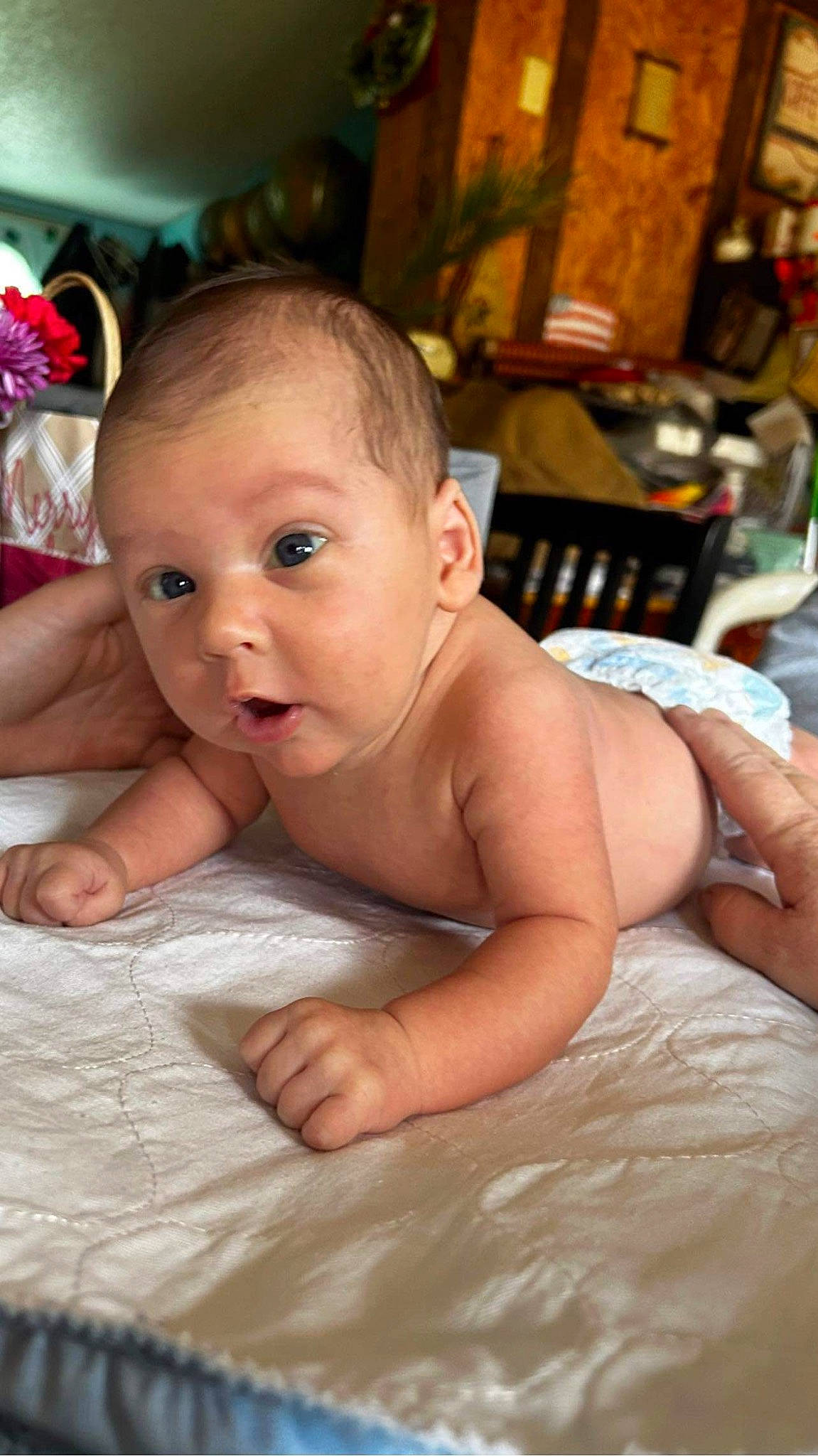 Jackson is registered to the contest to win money with this photo: baby, chair, cheek, chest, child, chin, event, eye, flooring, fun, hairstyle, happy, head, iris, person, room, sitting, skin, smile, surprise