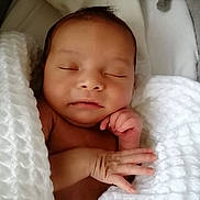Sensie is registered to the contest to win money with this photo: baby, newborn, sleeping, blanket, soft, peaceful, infant, cute, face, hand, skin, closeup, rest, cozy, child, portrait, warm, wrapped, relaxation, toddler