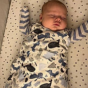 Isiah is registered to the contest to win money with this photo: animal, baby, bed, bird, blanket, cradle, crib, cushion, face, furniture, head, homedecor, infantbed, newborn, person, quilt, sleeping