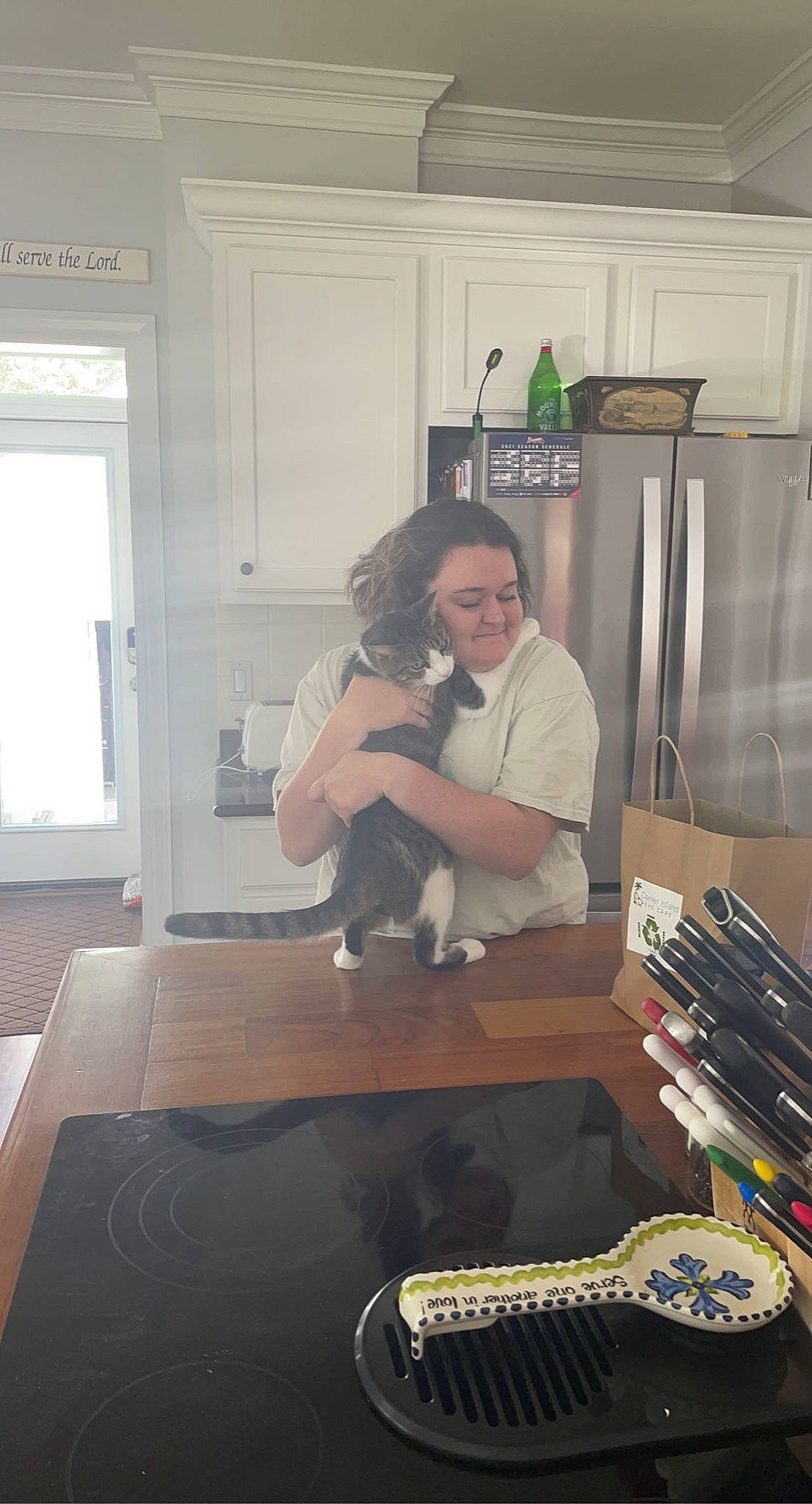 Chuck is registered to the contest to win money with this photo: audio_equipment, comfort, companion_dog, drawer, eyewear, flooring, fur, hardwood, kitchen, office_equipment, office_supplies, room, sitting, smile, sunglasses, t_shirt, toy, typewriter, window, wood