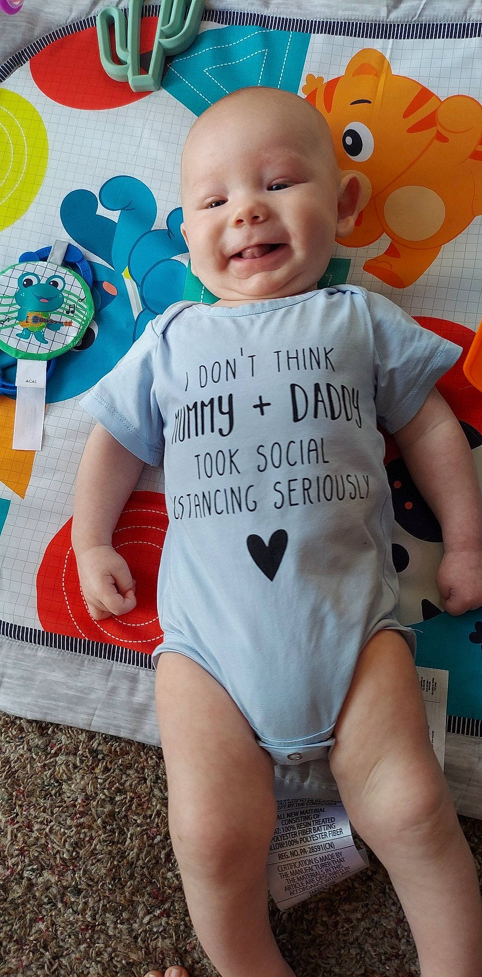 Allen is registered to the contest to win money with this photo: baby_toddler_clothing, eye, face, facial_expression, green, hairstyle, happy, head, mouth, neck, orange, organ, person, photograph, product, skin, sleeve, smile, t_shirt, textile