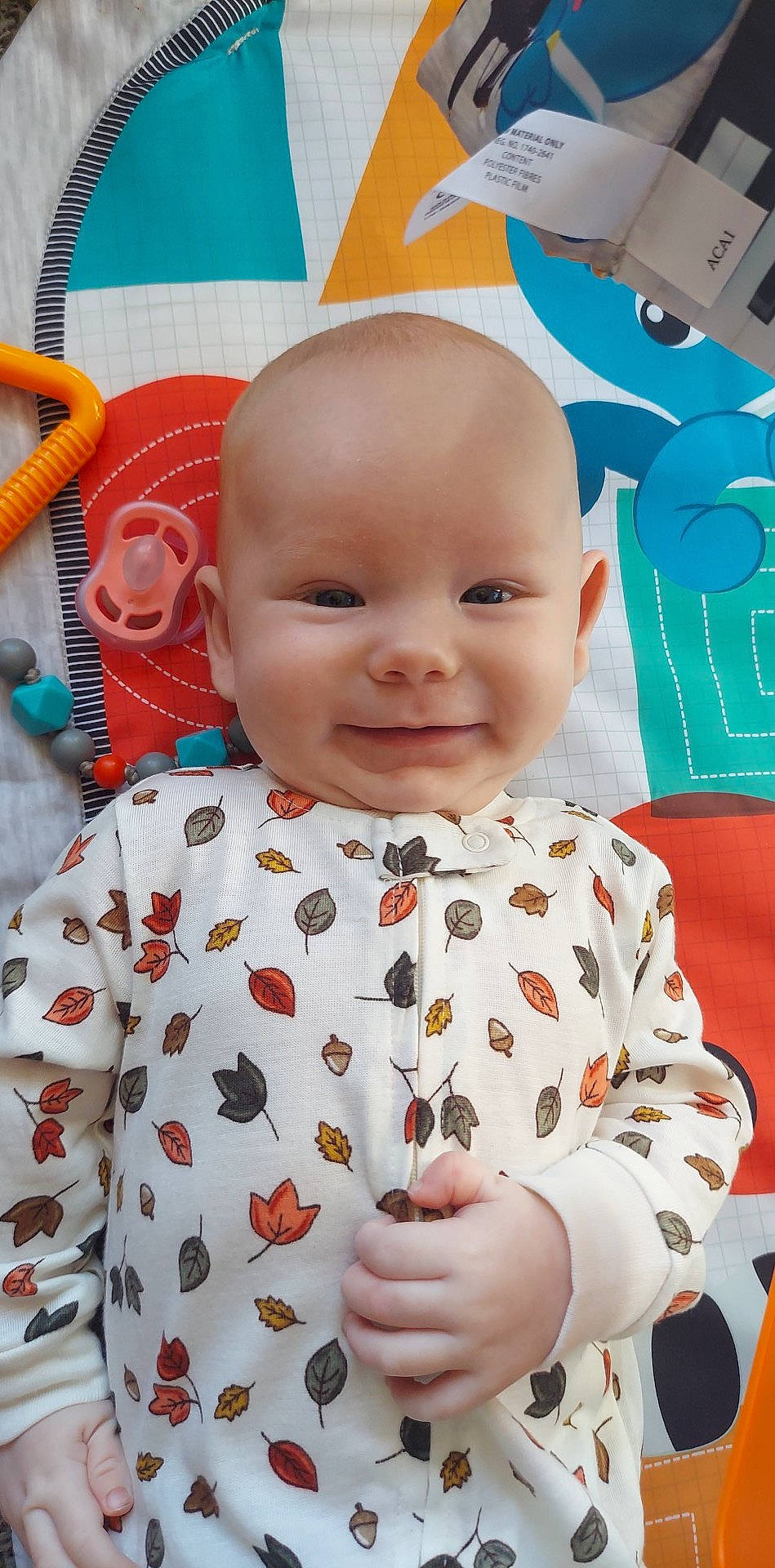 Allen is registered to the contest to win money with this photo: baby, baby_toddler_clothing, cheek, face, facial_expression, fun, happy, head, joy, nose, orange, organ, person, photograph, pink, red, skin, sleeve, smile, textile