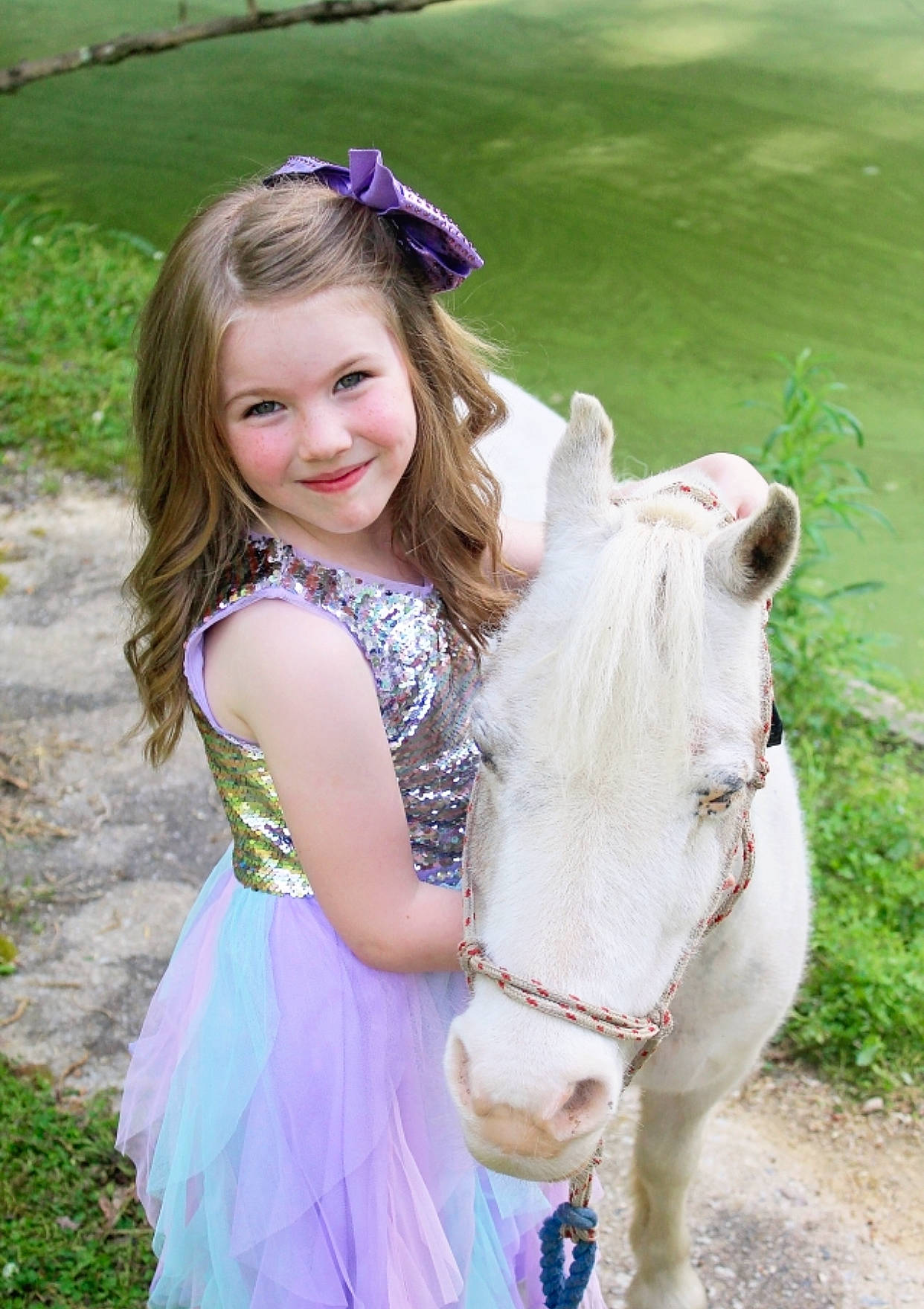 Grayleigh is registered to the contest to win money with this photo: clothing, dress, eye, fawn, grass, hair, hairstyle, happy, head, horse, horse_supplies, iris, joy, people_in_nature, person, photograph, pink, plant, smile, sunglasses