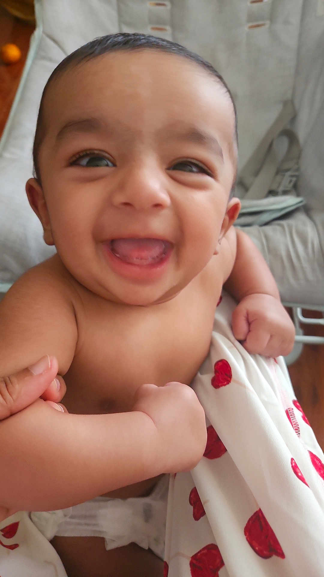 Alzaan is registered to the contest to win money with this photo: baby, smiling, infant, blanket, hearts, cute, happy, face, skin, diaper, hand, cushion, chair, indoors, closeup, child, person, expression, joy, comfort