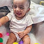 Alzaan is registered to the contest to win money with this photo: baby, child, bath, bubbles, colorful_balls, foam, happy, infant, joyful, laughing, playful, plastic_balls, sitting, smiling, toddler, water, white_clothing, indoor, cute, fun