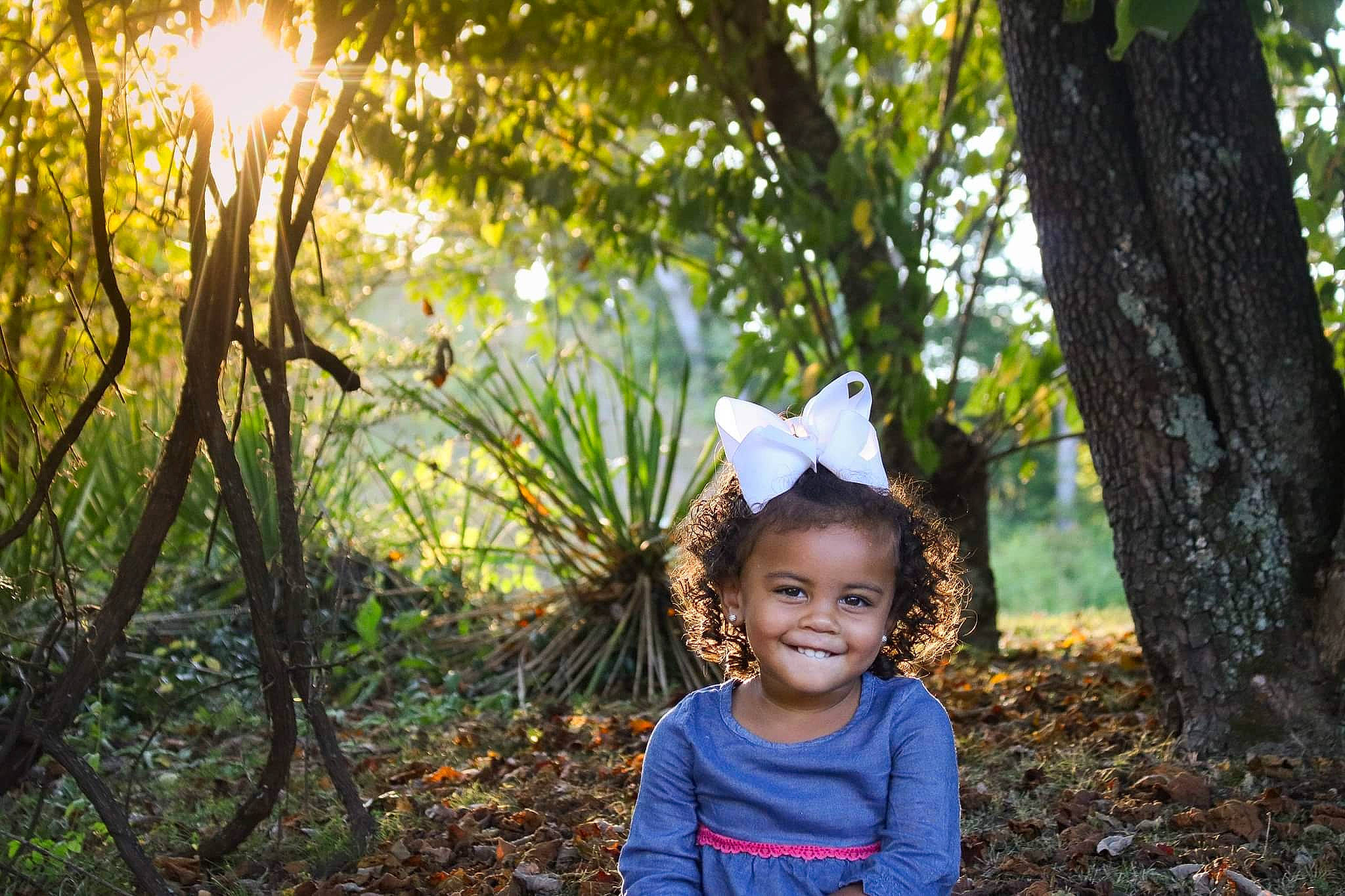 Zamaya is registered to the contest to win money with this photo: beauty, botany, branch, child, eye, happy, joy, leaf, light, natural_environment, natural_landscape, nature, people, people_in_nature, person, photograph, photography, smile, sunlight, toddler