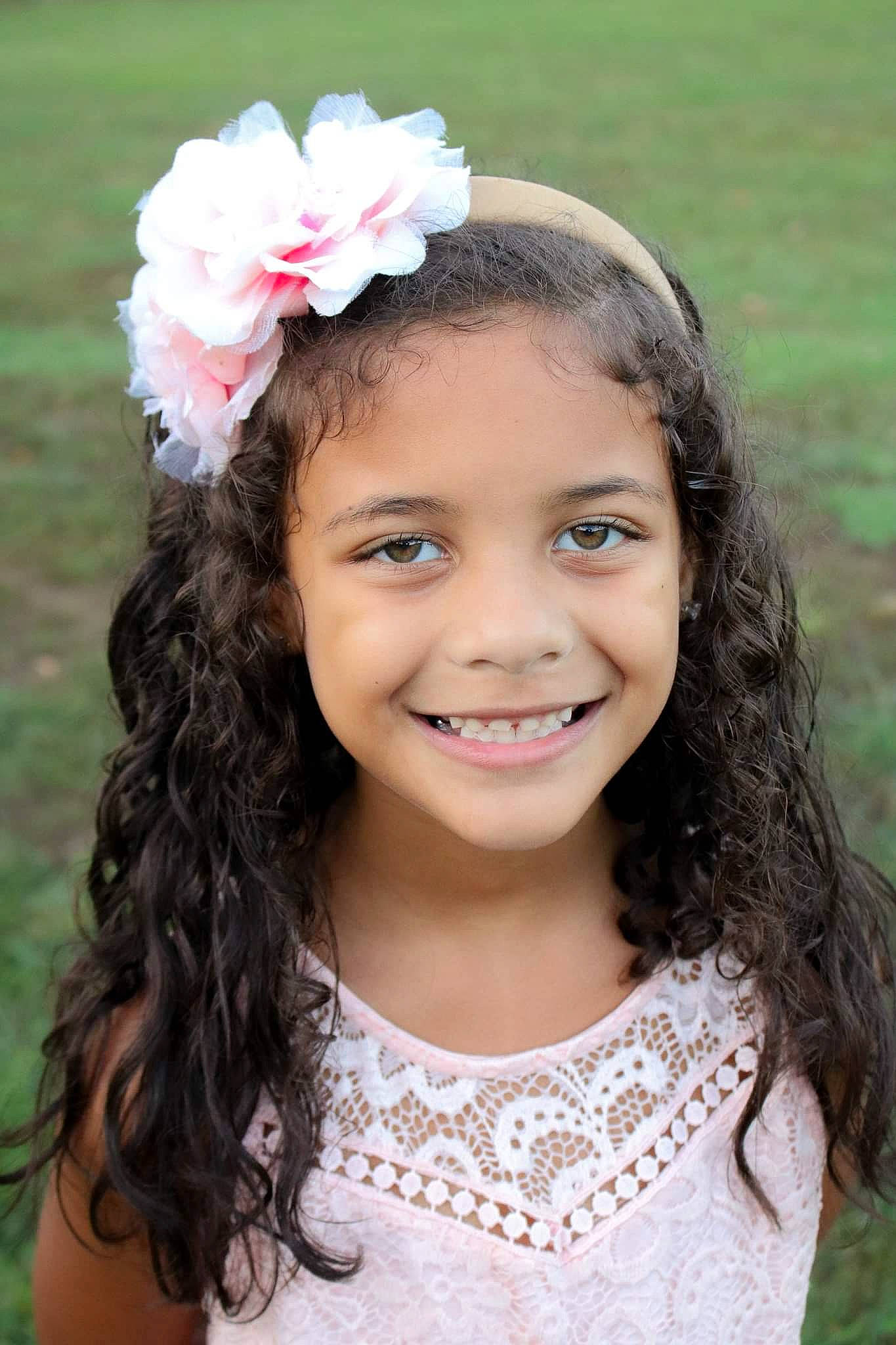 Quiana is registered to the contest to win money with this photo: brown_hair, child, child_model, fashion_accessory, flower_girl, hair, hair_accessory, hairstyle, headband, headgear, headpiece, joy, long_hair, person, smile