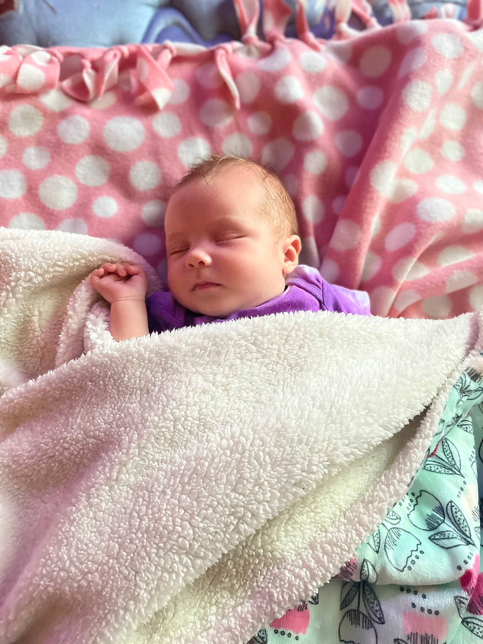 Ariya is registered to the contest to win money with this photo: baby, baby_sleeping, baby_toddler_clothing, bedding, bedtime, blanket, cheek, child, comfort, linens, magenta, pattern, person, pink, product, room, skin, sleep, sleeve, textile