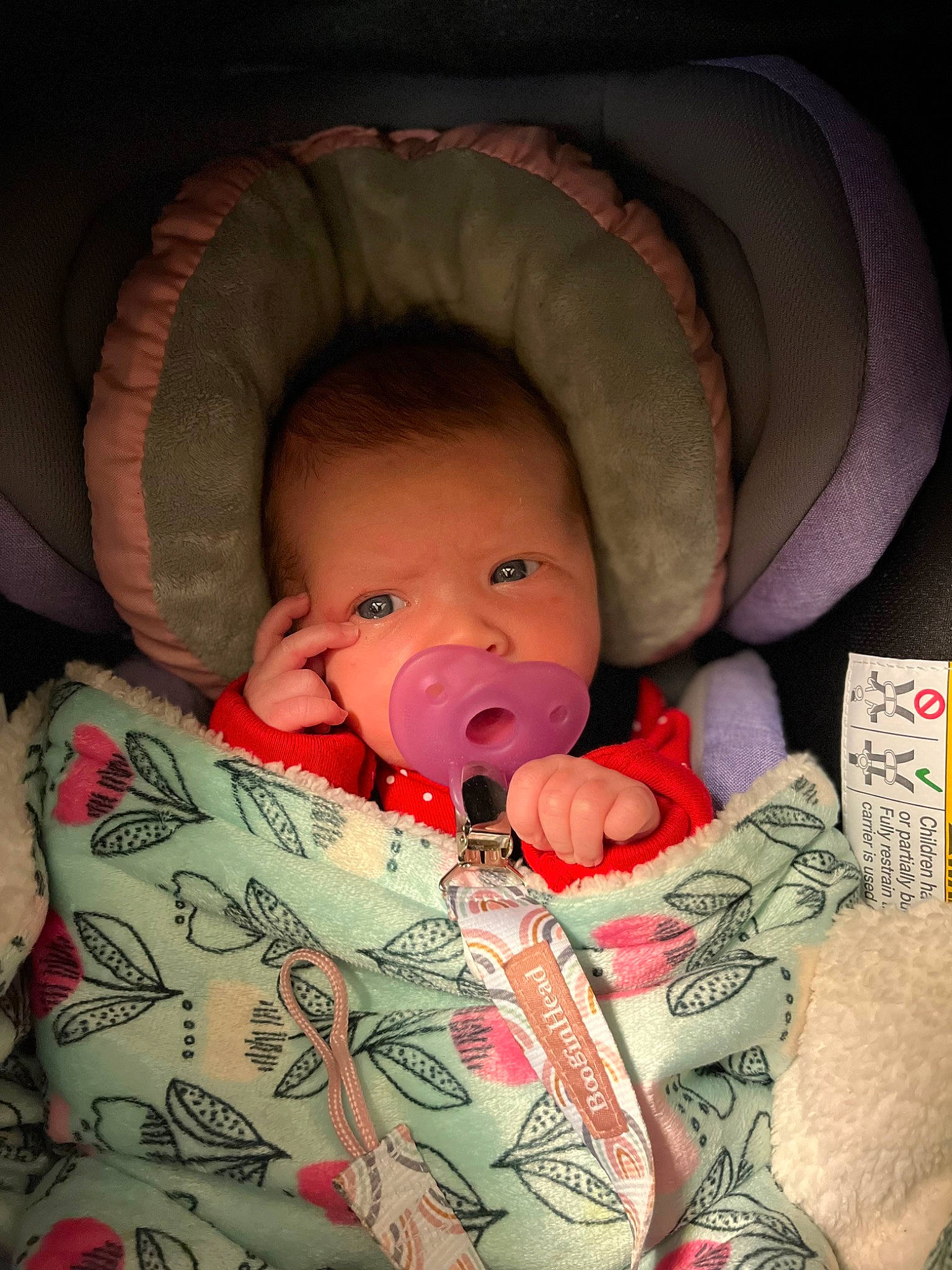 Ariya is registered to the contest to win money with this photo: baby, baby_sleeping, baby_toddler_clothing, cheek, comfort, ear, eye, eyelash, face, finger, head, helmet, human_body, infant_bed, lip, mouth, nose, person, pink, skin