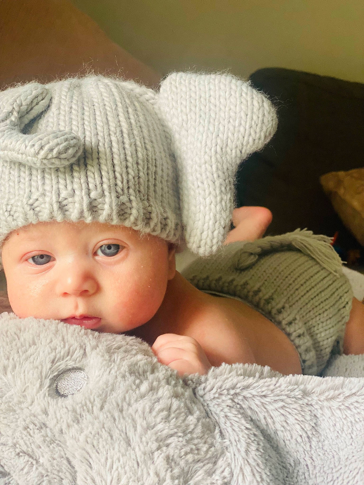 Elliot is registered to the contest to win money with this photo: baby, baby_sleeping, baby_toddler_clothing, beanie, cap, child, comfort, fashion_accessory, fur, headgear, headwear, human_leg, knit_cap, linens, pattern, person, skin, sleeve, textile, toddler