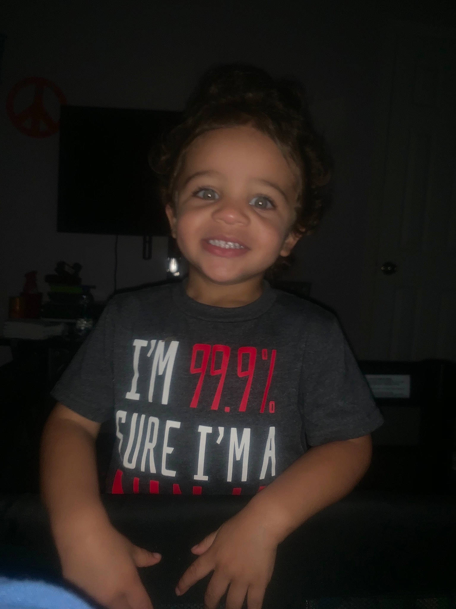 Kyron joined the competition — help win amazing prizes! arm, cheek, child, chin, cool, darkness, face, facial_expression, finger, forehead, fun, hand, head, joy, mouth, organ, person, sitting, smile, t_shirt