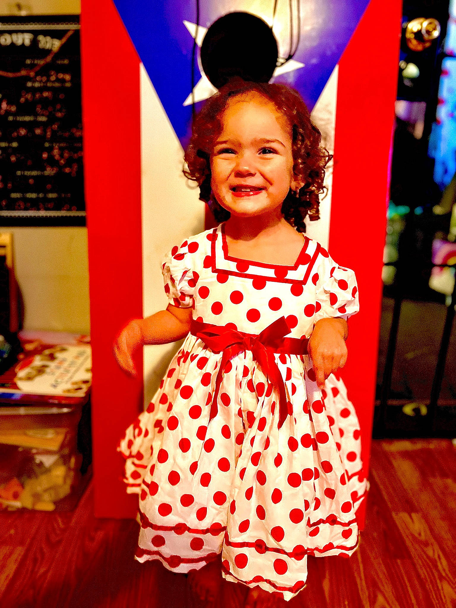 Annalee is registered to the contest to win money with this photo: baby_toddler_clothing, child, day_dress, dress, entertainment, event, fashion_design, flooring, fun, happy, joy, magenta, one_piece_garment, orange, pattern, peach, person, pink, red, sleeve