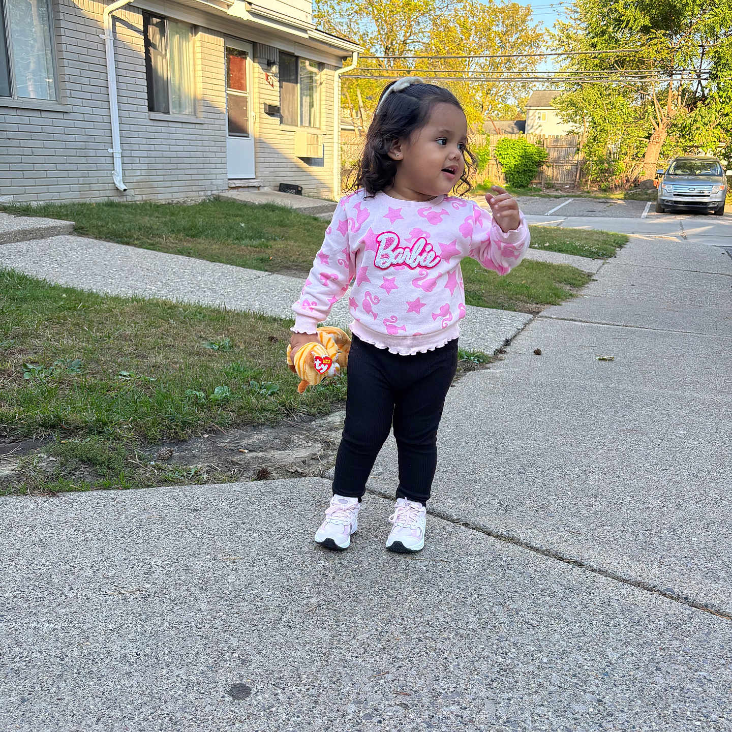 Hazel is registered to the contest to win money with this photo: bodypart, child, city, clothing, face, female, finger, girl, hand, head, longsleeve, neighborhood, pants, path, person, photography, portrait, sidewalk, sleeve, walking