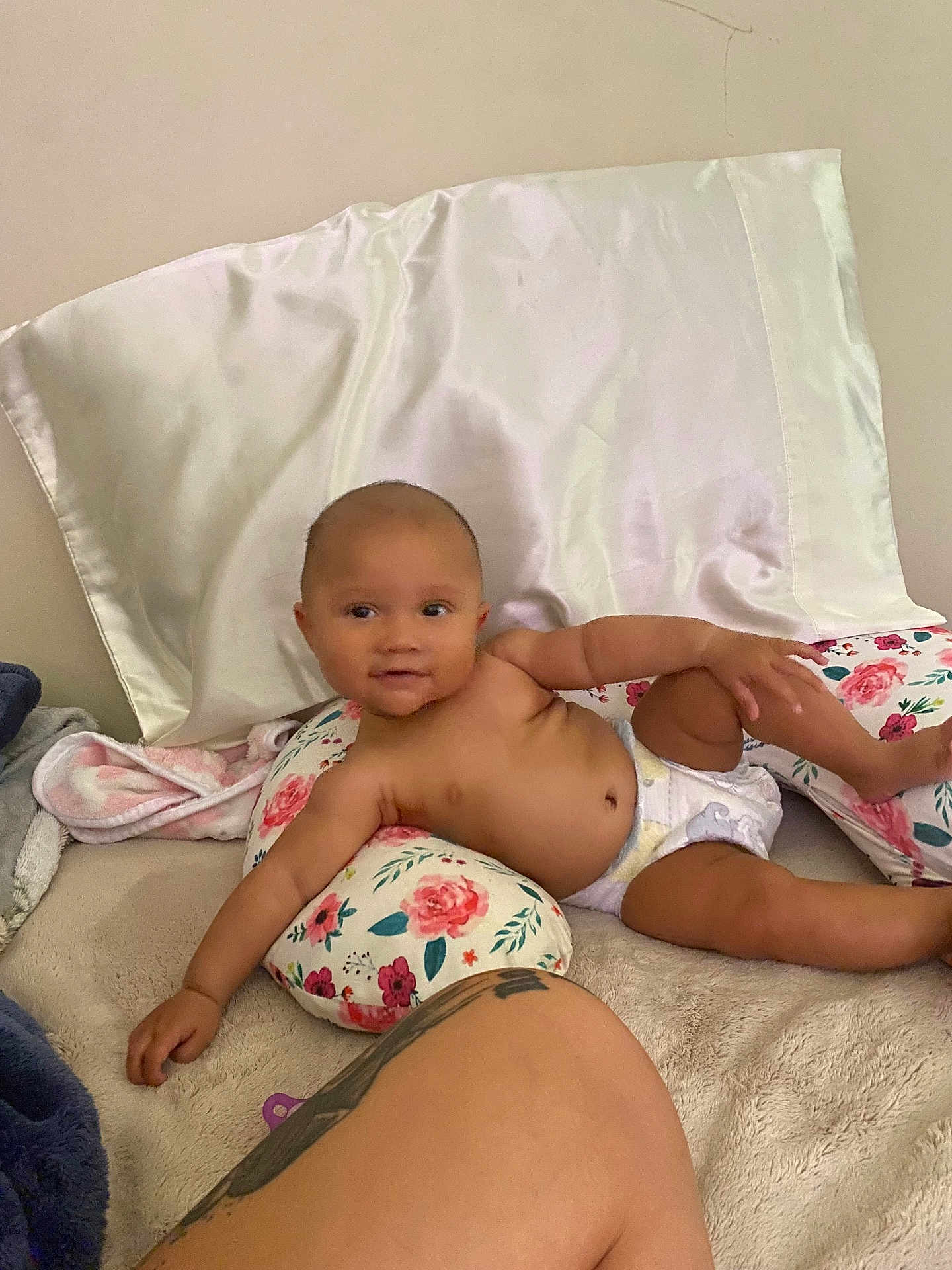 Vivienne joined the competition — help win amazing prizes! baby, child, diaper, pillow, floral_pattern, blanket, bed, tattoo, skin, arm, leg, relaxed, indoors, person, comfort, couch, smile, head, face, resting
