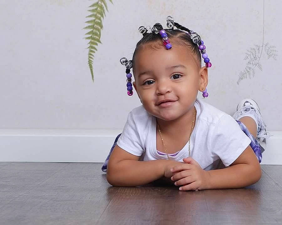 Kennedi is registered to the contest to win money with this photo: baby, baby_toddler_clothing, cheek, child, ear, eyelash, flash_photography, flooring, fun, grass, happy, headband, headgear, headpiece, iris, jewellery, joy, person, plant, skin